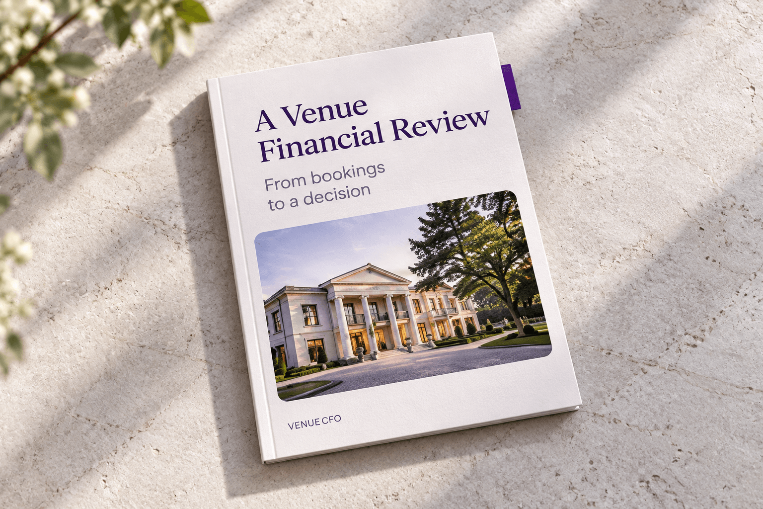 A Venue Financial Review book on a limestone table.